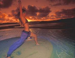 yoga on the beach at Sodwana Bay South Africa. a sunset a... by Fiona Ayerst 